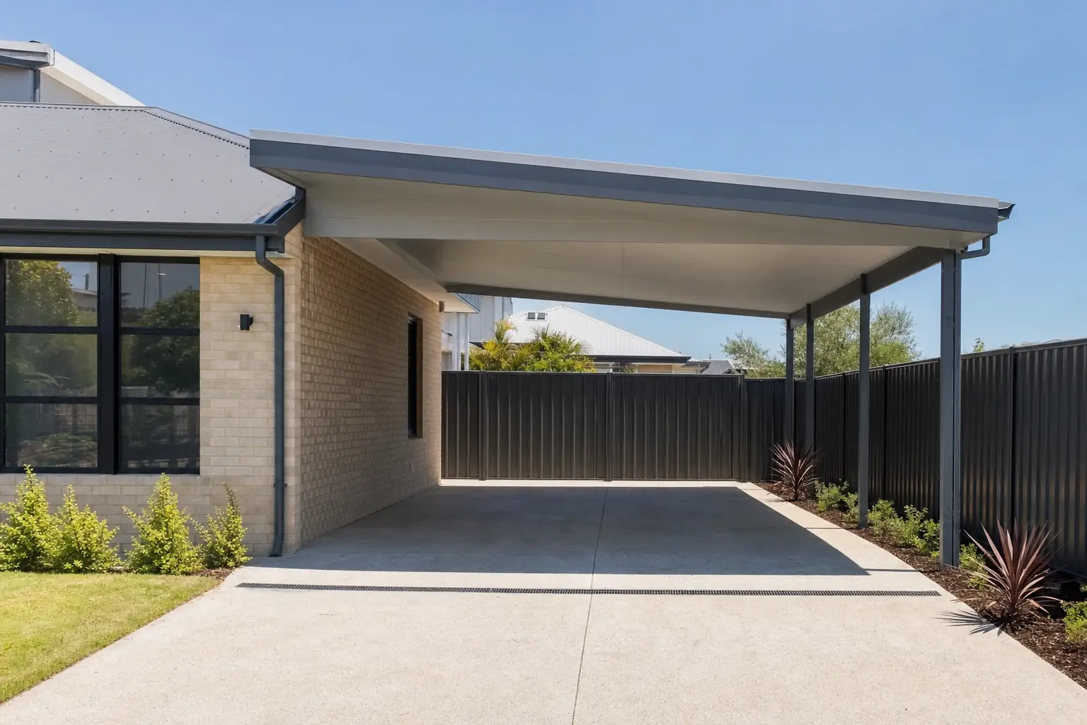 Attached carport tied to existing home in Perth, shared roofline